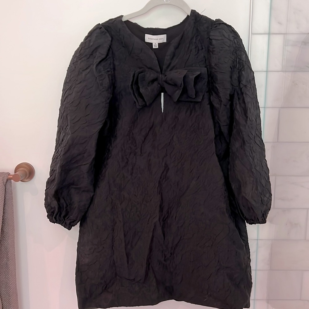 Pretty black party dress! Big bow, so girlie. Never worn! Tags on it.